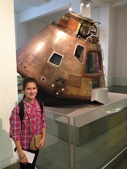 Picture of a child wearing a pink shirt with the Apollo 10 command module.
